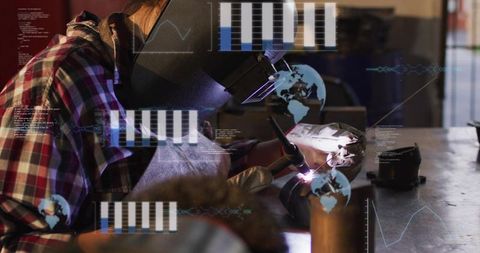 Female welder performing precision arc welding with helmet and hud overlays in workshop