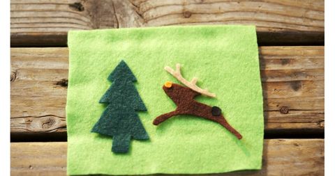 Festive wool decorations with reindeer and pine tree