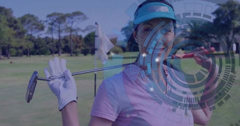 Smiling woman golfer holding putter on putting green with futuristic HUD overlay