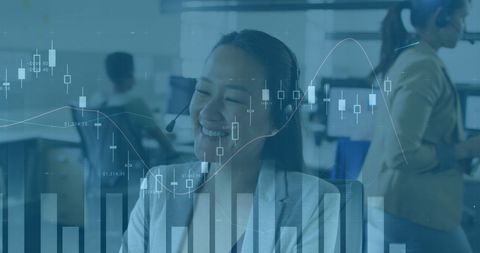 Businesswoman Using Headset Analyzing Financial Data in Office