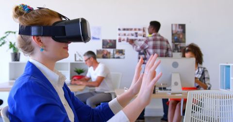 Businesswoman Engaging with VR in Modern Office - Download Free Stock Images Pikwizard.com