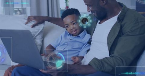 Father and Son Enjoy Interactive Technology Experience at Home