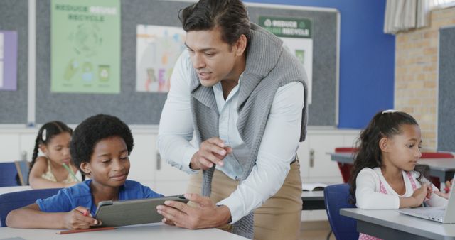 Teacher Assisting Student with Tablet in Modern Classroom - Download Free Stock Images Pikwizard.com