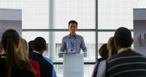 Asian Male Speaker Delivering Presentation at Business Seminar - Download Free Stock Images Pikwizard.com