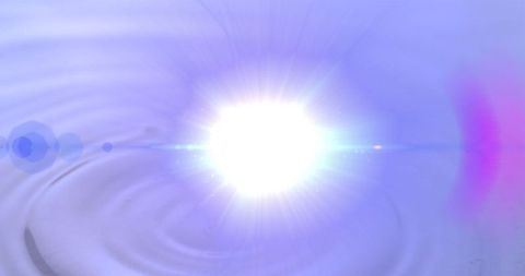 Ethereal light flare over rippling water surface