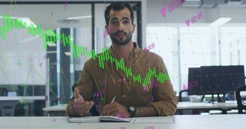 Middle eastern businessman analyzing financial data in office