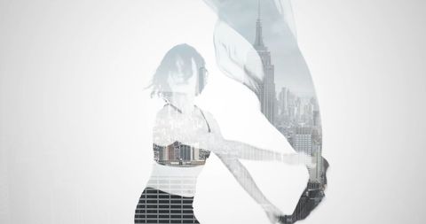 Creative double exposure of dancer and cityscape
