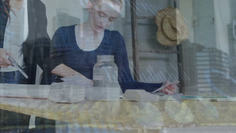 Diverse Businesswomen Collaborating Amid Data Technology Graphics