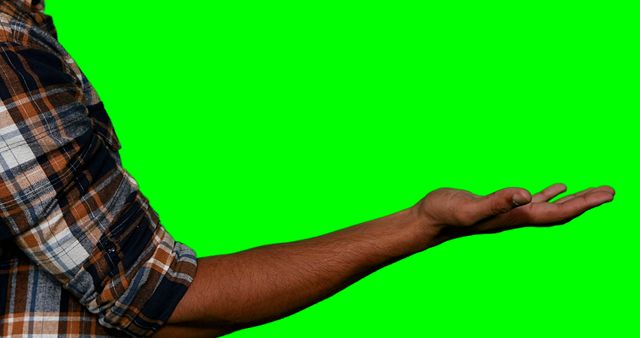 Man pretending to hold screen against green screen