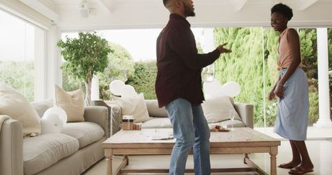 Young Couple Enjoying Quality Time in Living Room Setting