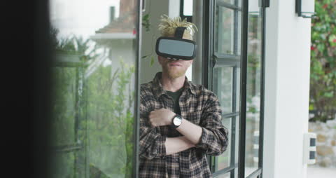 Albino Man with Dreadlocks Experiencing Virtual Reality Technology