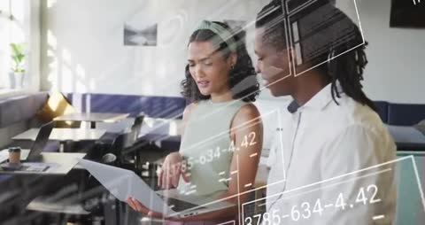 Colleagues Analyzing Digital Data and Charts on Laptop Together