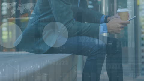 Businessman Engaging with Financial Technology on Tablet