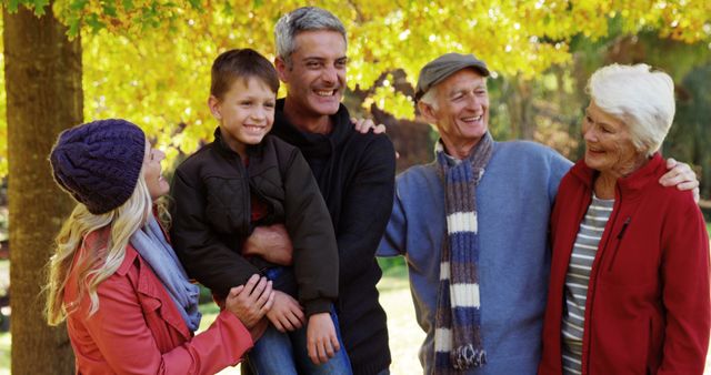 Multi-Generational Family Bonding Outdoors in Autumn Park - Download Free Stock Images Pikwizard.com