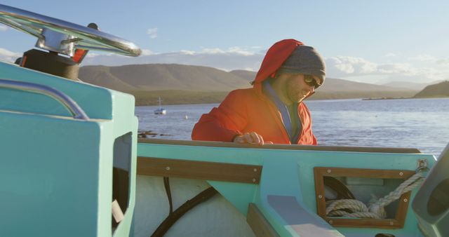 Man Navigating Boat on Sunny Day Enjoying Outdoor Adventure - Download Free Stock Images Pikwizard.com