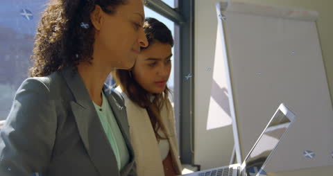 Biracial Businesswomen Collaborating with Digital Interface