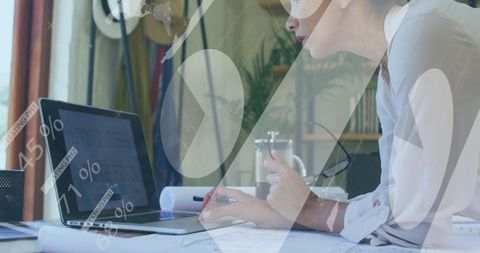 Woman analyzing financial data visualization on laptop