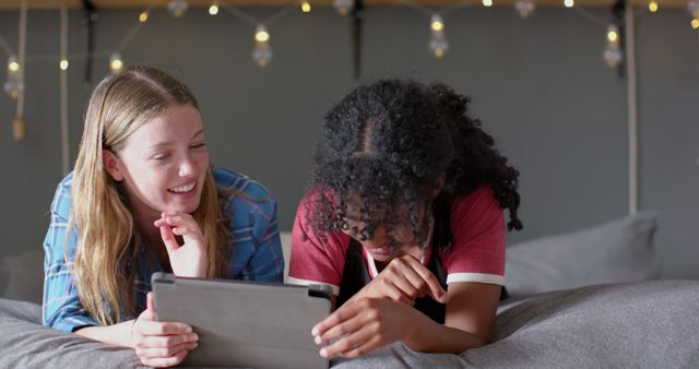 Diverse Teenage Friends Using Tablet and Enjoying Time Indoors - Download Free Stock Images Pikwizard.com