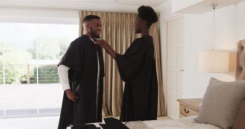 Couple preparing outfits together in cozy home environment