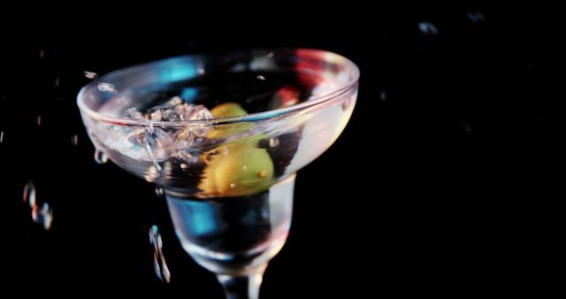 Splashing Martini with Olives on Black Background - Download Free Stock Images Pikwizard.com