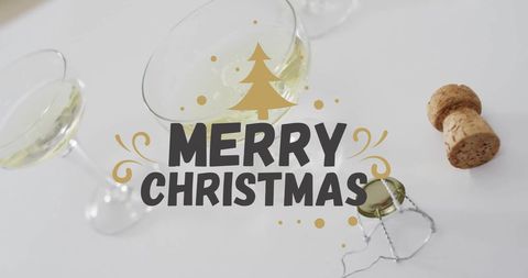 Festive cheers with merry christmas greeting over wine glasses