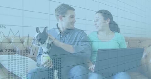 Couple Analyzing Personal Finances at Home with Pet