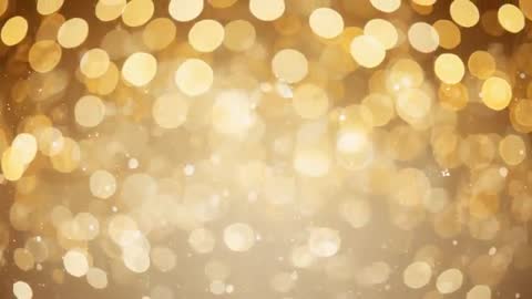 Looping golden bokeh background shimmering with floating sparkles for celebration video