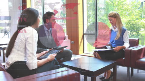 Business Team Analyzing Data in Modern Office Lounge