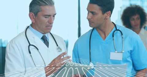 Doctors reviewing digital patient data on tablet with binary overlay for health it teams