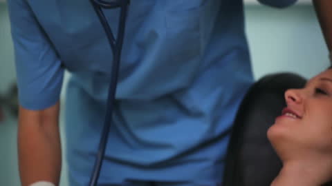 Nurse Checking Vital Signs of Donor in Hospital Setting