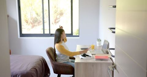 Home Office Productivity: Biracial Woman Coordinating at Laptop - Download Free Stock Images Pikwizard.com