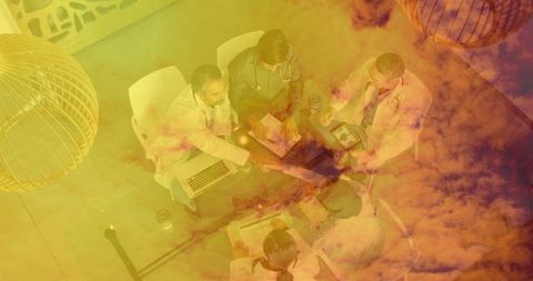 Medical Professionals Collaborating with Technology in Hospital Meeting