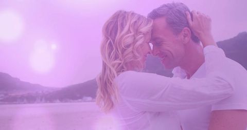 Romantic Caucasian Couple Embracing with Purple Glow