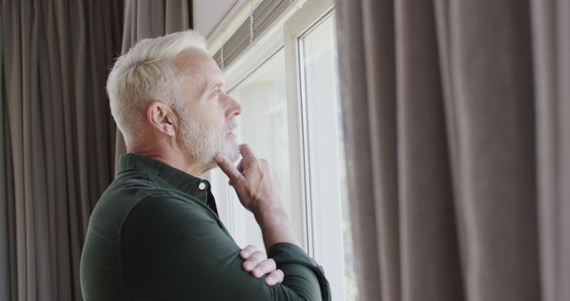 Thoughtful Middle Aged Man Looking Out Window Alone - Download Free Stock Images Pikwizard.com