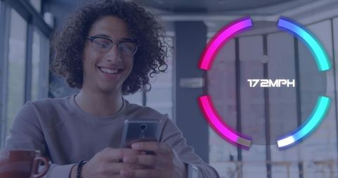 Young man engaging with mobile technology at cafe