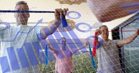 Mature adults exercising with resistance bands on terrace with fitness data and charts
