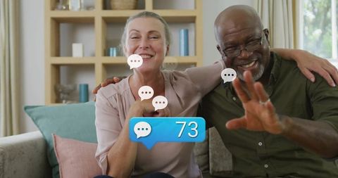 Senior couple engaging in online chatting at home