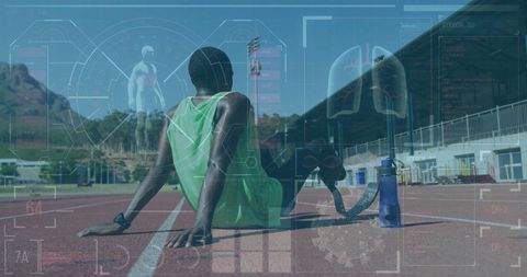Teenage athlete with prosthetic leg resting on track with water bottle