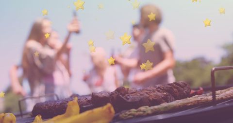 Blurred Friends Celebrating Bbq with Star Design Overlay