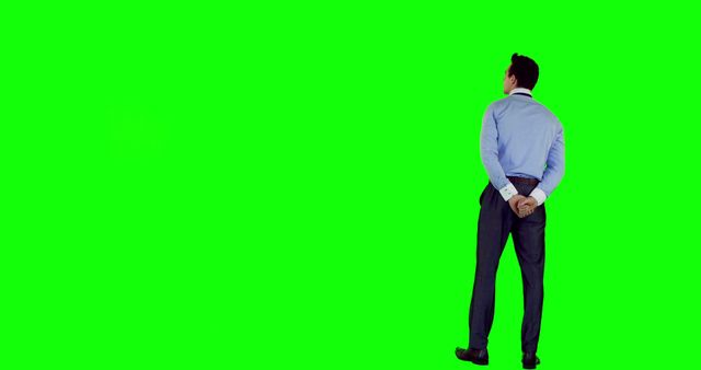 Businessman Standing with Hands Behind Back on Green Screen Background - Download Free Stock Images Pikwizard.com