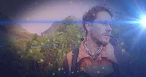 Bearded Man Hiking on Scenic Mountain Trail at Dusk