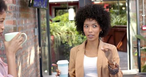 Casual Business Networking Over Coffee Outdoors