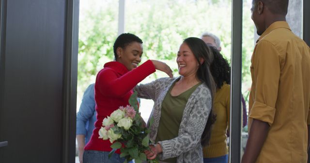 Friends Greeting Each Other with Warm Hug and Flowers - Download Free Stock Images Pikwizard.com