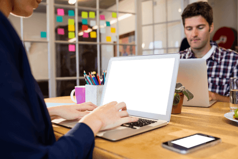 Team Collaboration with Transparent Laptop Screen in Office Environment - Download Free Stock Videos Pikwizard.com