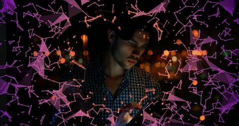 Young Man on Rooftop Interacting with Digital Network Display