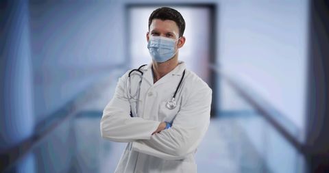 Confident Doctor Wearing Mask in Hospital Corridor