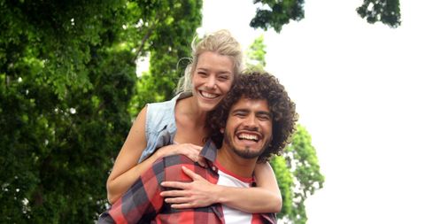 Smiling Friends Enjoying Sunny Day Outdoors