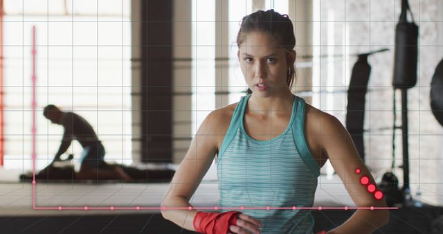 Focused Female Boxer Training in Gym Setting with Graph Overlay - Download Free Stock Images Pikwizard.com