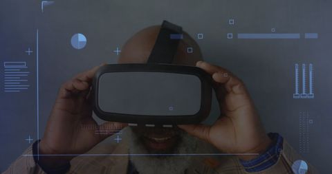 Senior Man Engaging with Virtual Reality Technology Interface