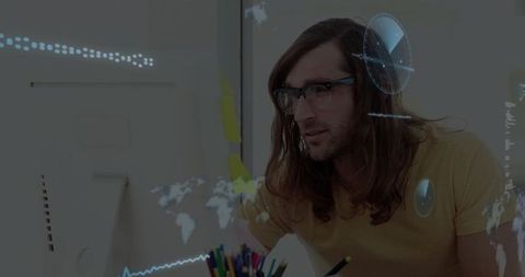 Man Analyzing Data Visualizations in Home Office Workspace